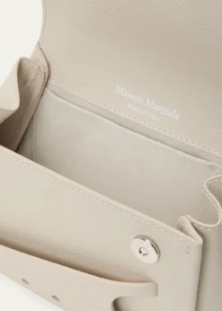 Maison MargielaSnatched Micro Asymmetric Top-Handle Bag
